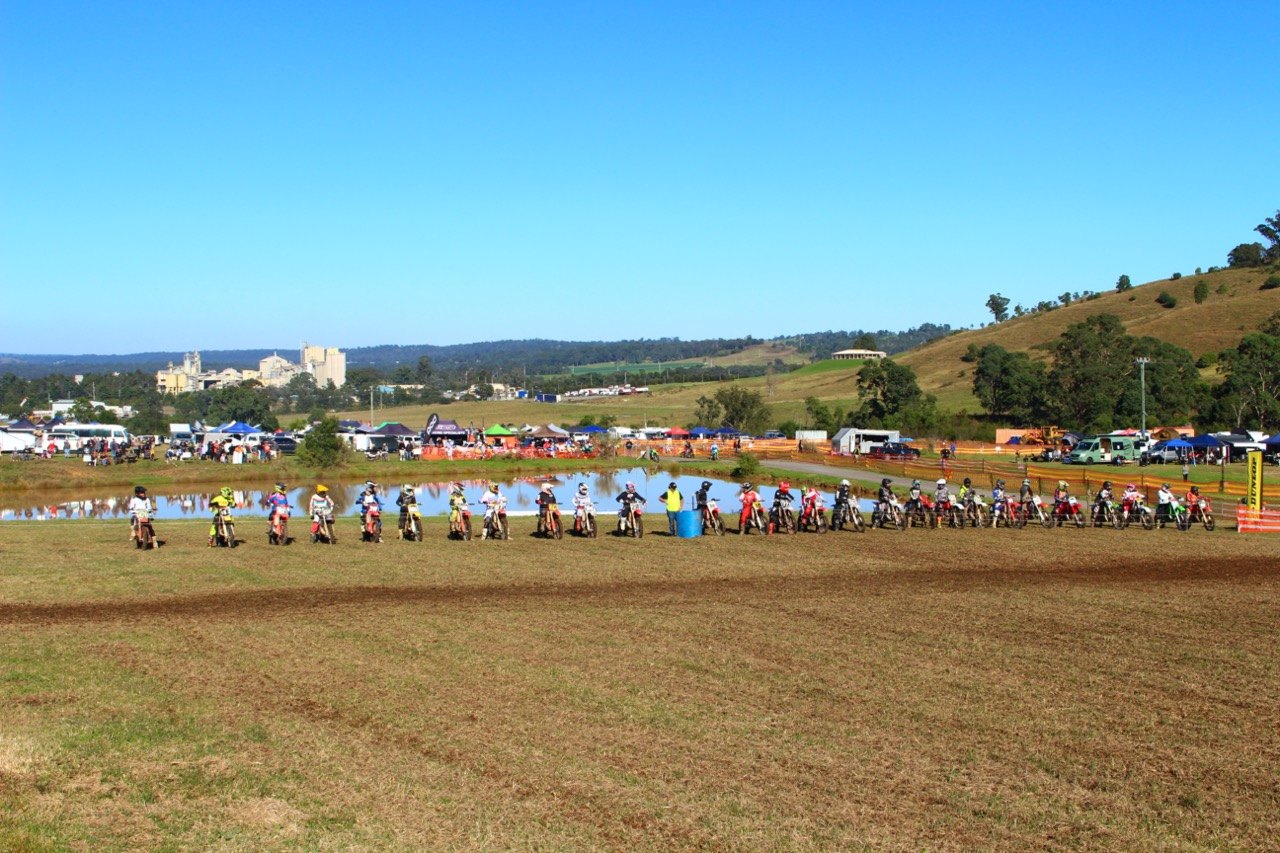 Vintage motocross bikes lined up at a Heaven VMX event